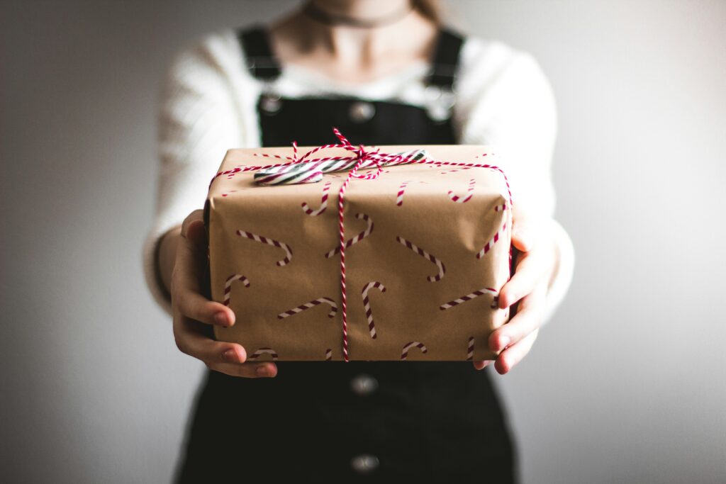 Women holding a Christmas present