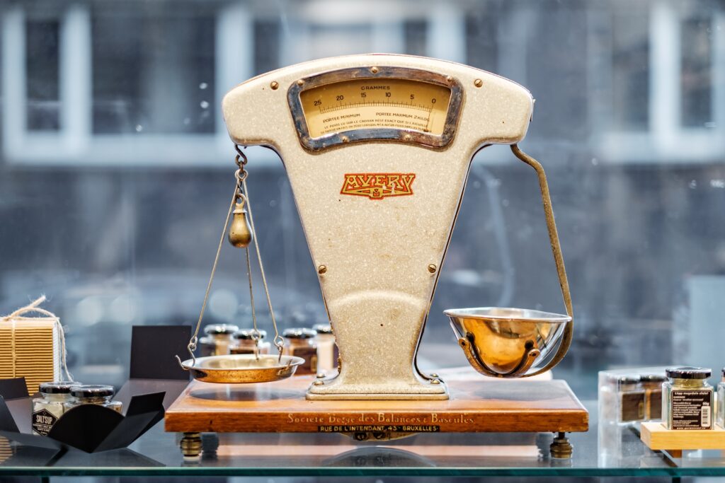 weighing up the pros and cons on an antique weighing scale