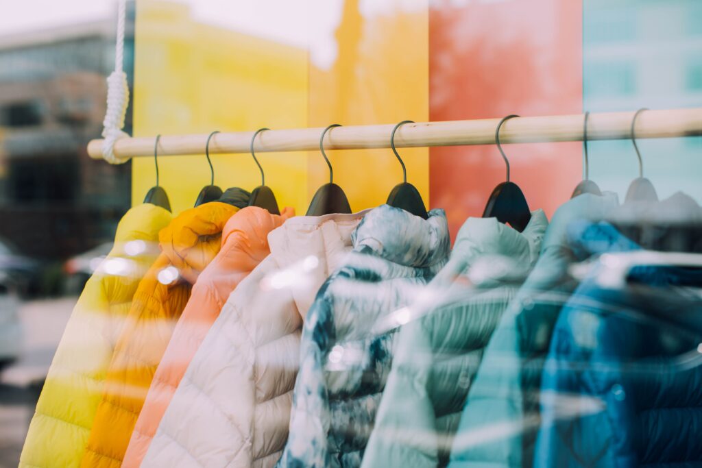 Colourful jackets hanging on a rail